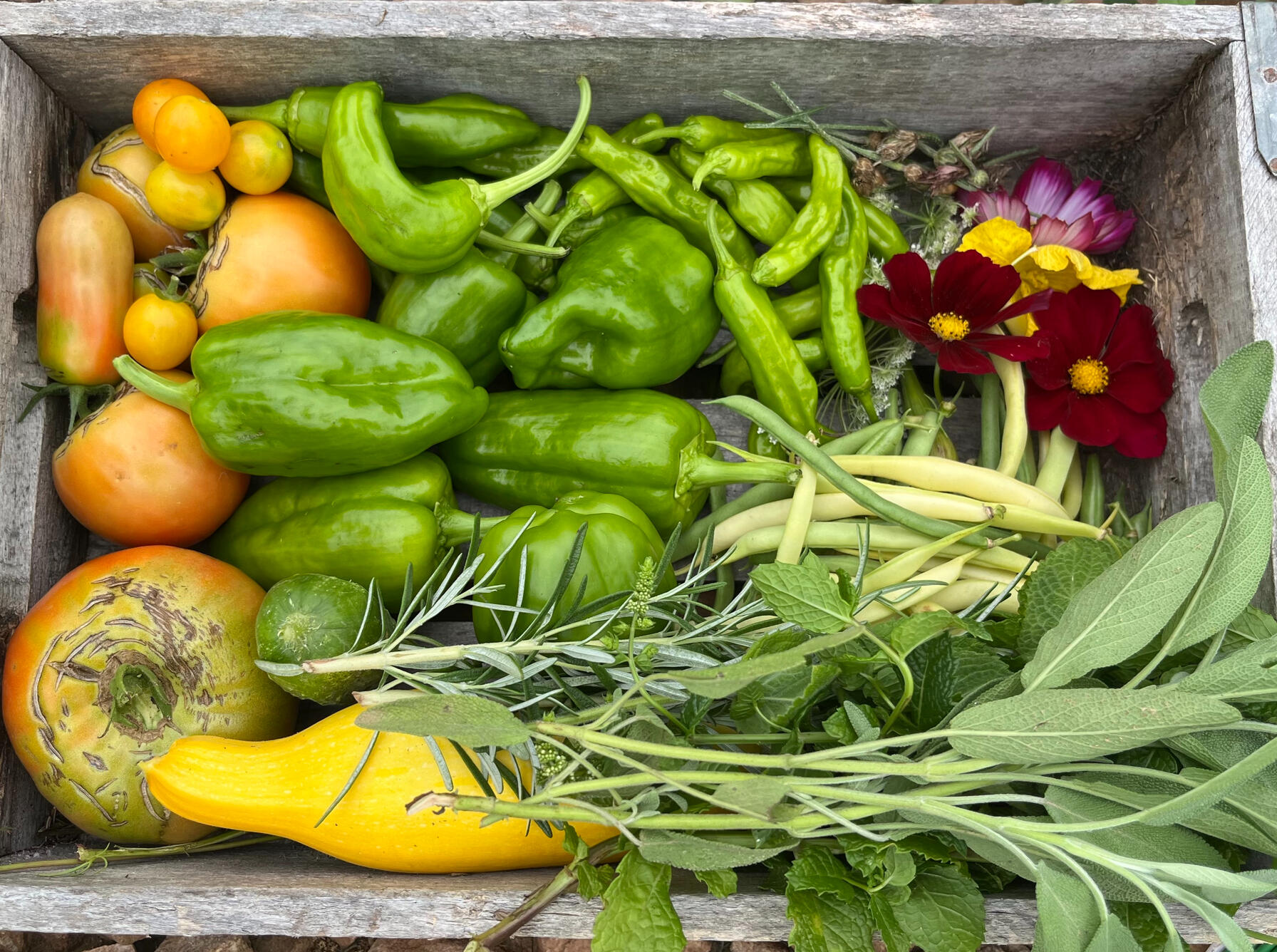 a wood basket with vegetables