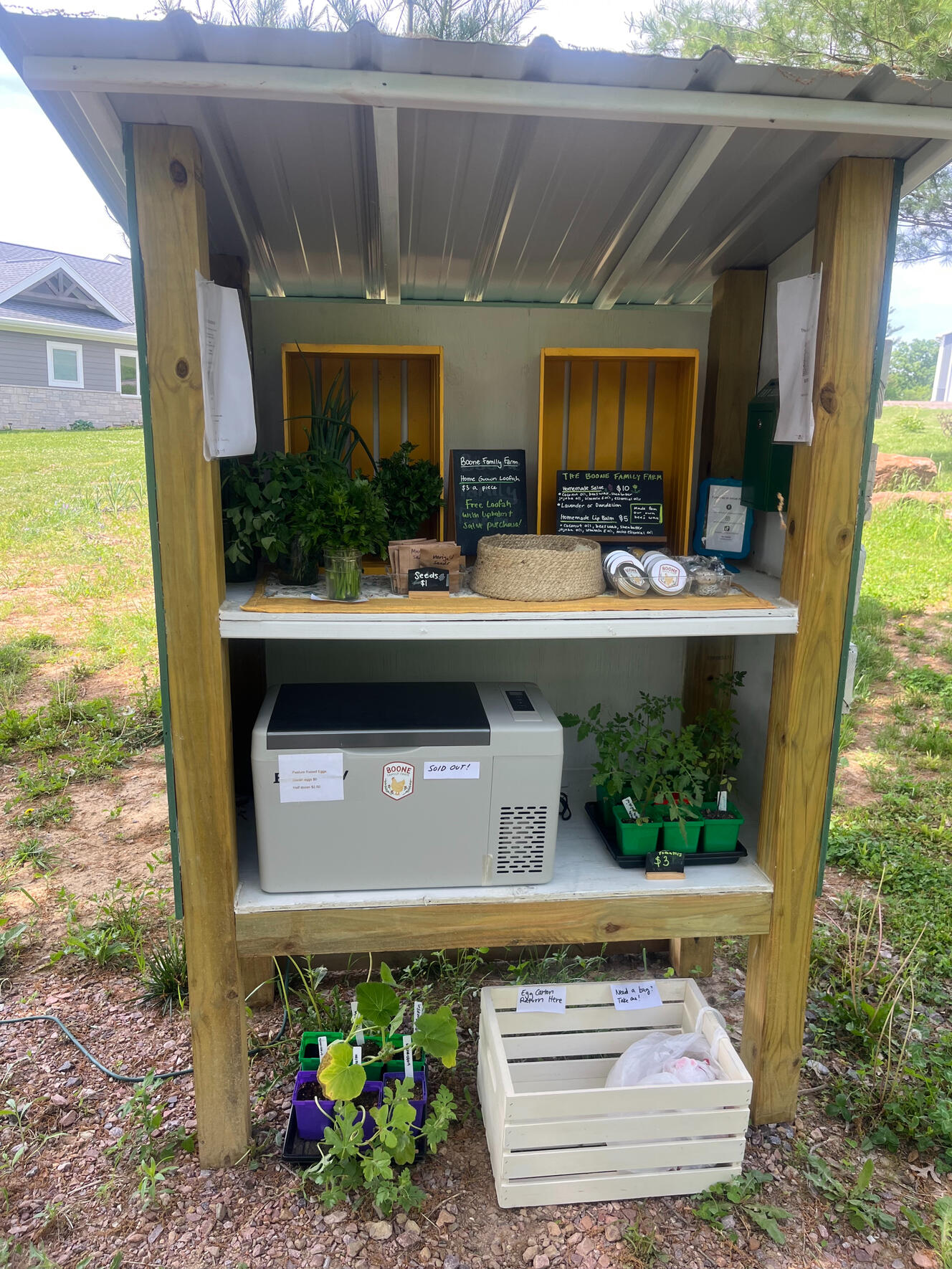 A farm stand with various items for sale